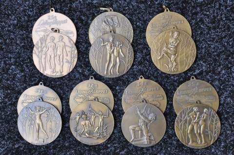 Lingöloppsmedaljer från 90-talet med Carl Milles motiv.